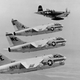 Family photo: a F4U Corsair flies alongside a trio of A-7 Corsair IIs prior to the A-7's first deployment to Southeast Asia in 1967 (US Navy)